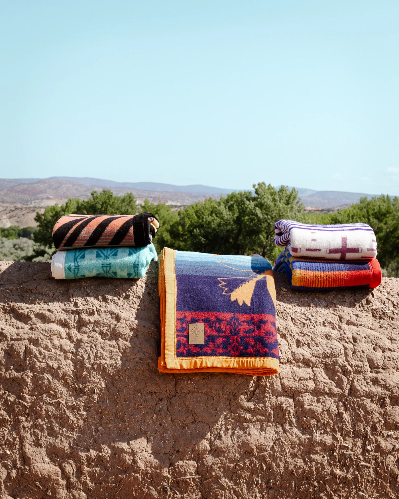 Eighth Generation wool blanket collection featuring Reflection, Spider Woman, Legacy, New Day, and Warrior wool blankets
